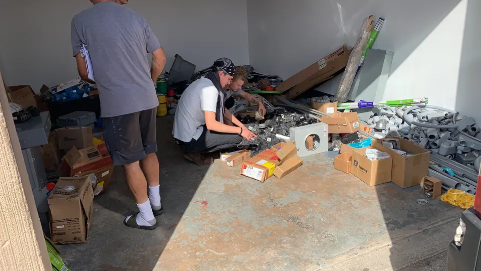 In Phaze Electric team sorting electrical supplies in the warehouse