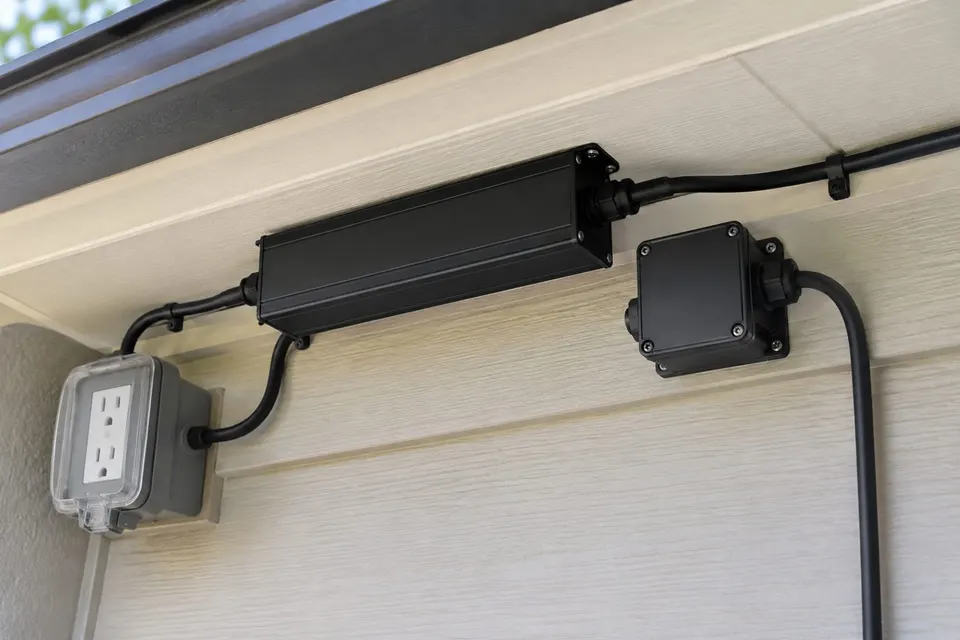 Power supply and controller tucked under the eave (illustration)