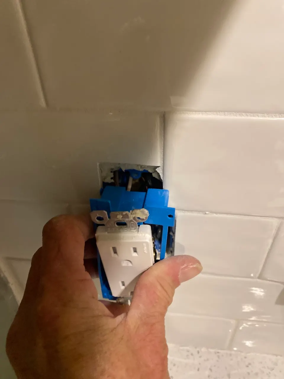 New electrical box being installed during a rewire