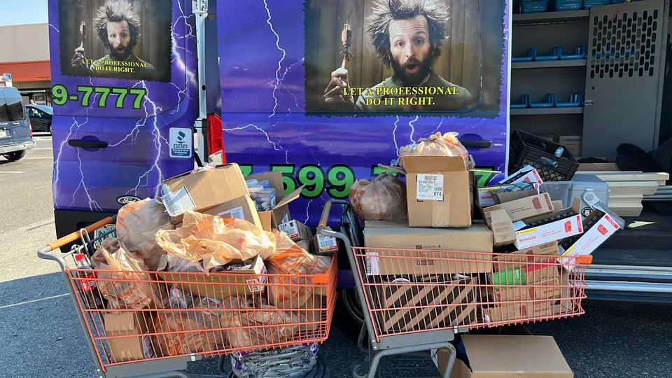 In Phaze Electric purple work van loaded with electrical supplies